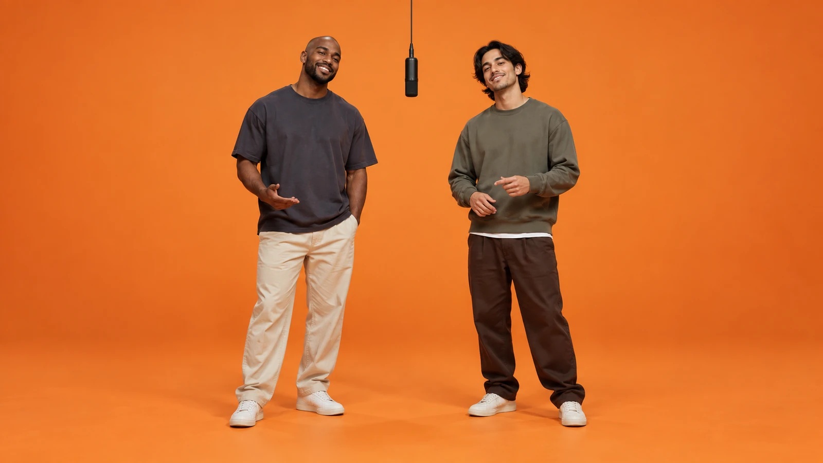 Friends: illustrated orange booth with two performers and a hanging microphone